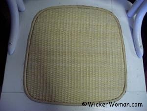 Close-woven cane webbing seat. Close-woven cane webbing seat.