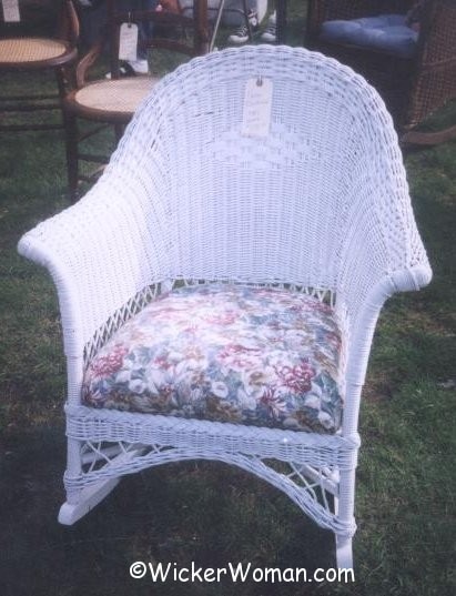 1930s paper wicker rocker with upholstered set-in spring cushion. 