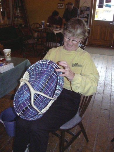 Kathryn, North House Folk School student in the antler basket class with her nearly finished antler basket.
