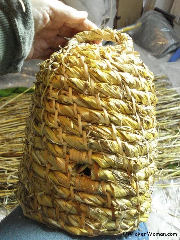 Rustic, straw bee skep woven by Cathryn Peters.