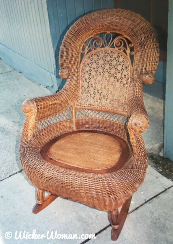 Restored Heywood-Wakefield gentleman's wicker rocker with closed cane seat.