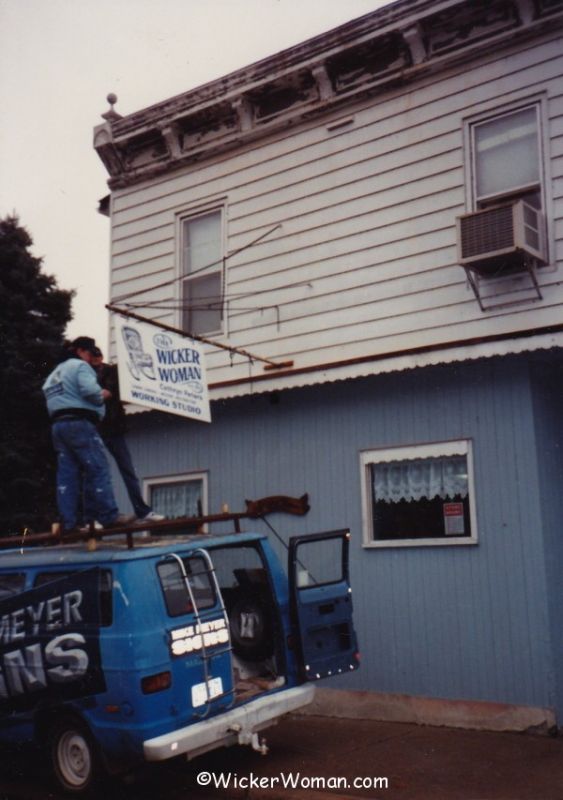 Mike Meyer Signs erecting Wicker Woman sign