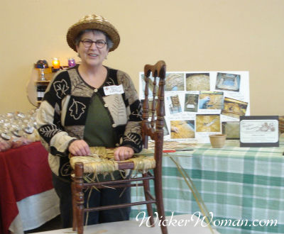 Cathryn Peters demonstrating hand-twisted cattail rush seat