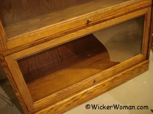 broken glass in barrister bookcase