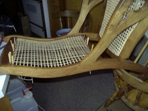 Chair caning a Lincoln rocker back.