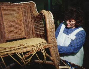 Cathryn repairing paper wicker rocker