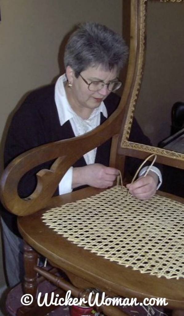 Cathryn Peters weaving hole cane seat