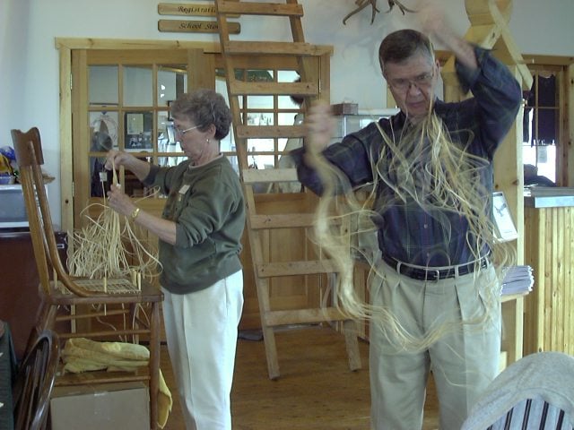 Students selecting cane from their bundles during Cathryn Peters' North House Chair Caning Class
