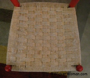 red modern chair with checkerboard Danish cord woven seat