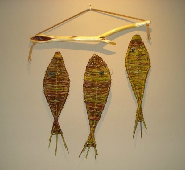 Woven diamond willow fish wall hanging, suspended from a diamond willow rod and suede hanger. 