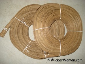 Coils of flat-oval smoked rattan reed