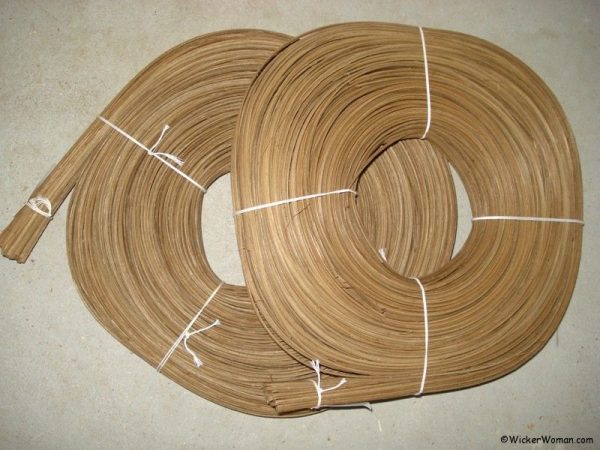 Coils of flat-oval smoked rattan reed