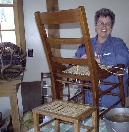 Cathryn Peters, founder of the Seatweaving & Chair Caning Forum is demonstrating hole to hole chair caning. 