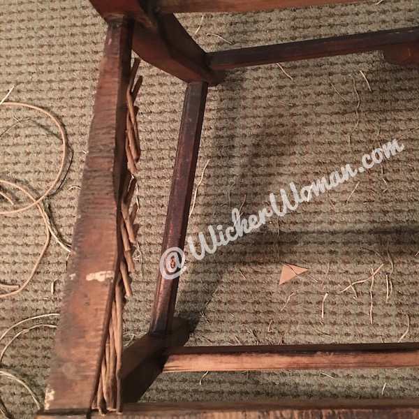 Many paper rush ends attached to inside rails with upholstery tacks. 