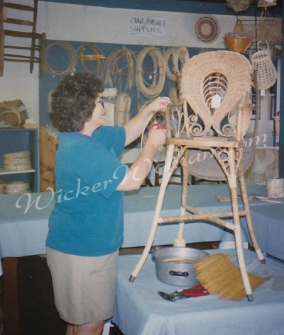 Peters repairing Victorian wicker highchair