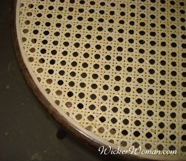 Spline cane sheet installed in round chair seat frame.