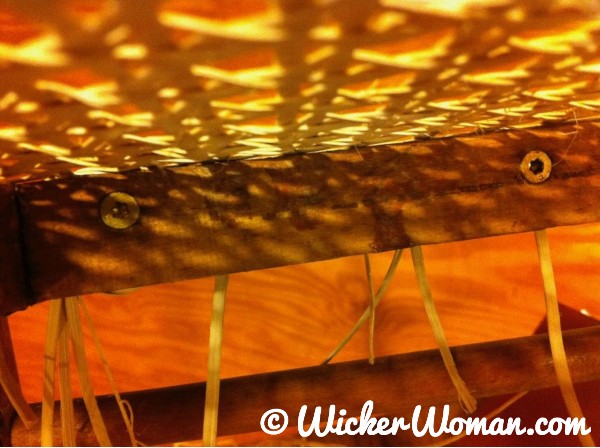 Hole cane broken rail repaired with glue and screws placed horizontally between holes on inside rail.