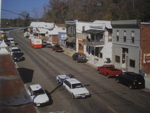 Small Town Minnesota from A to Z  photo of the main street in Zumbro Falls, Minnesota, taken from the rooftop of The Wicker Woman business. On the upper left hand corner you can see one of the remaining, rare finials that used to be on all the roofs of the  1800s buildings in town. 
