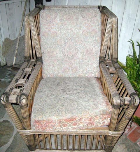 1930s stick wicker with upholstered cushions for seat and back.
