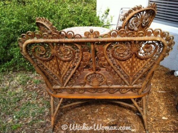 Back view of Victorian Heywood Brothers heart-shaped wicker settee.