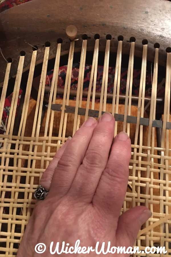 Weaving a traditional hole cane seat using a caning needle steamer. 