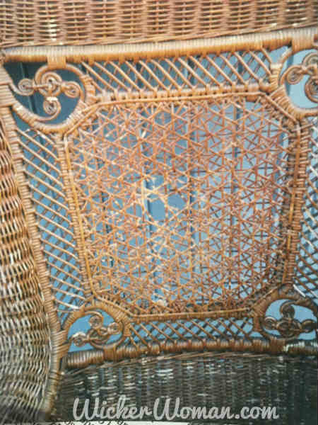 Damaged Star of David cane back in Victorian wicker rocker